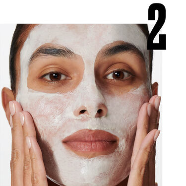 hands holding cleansers