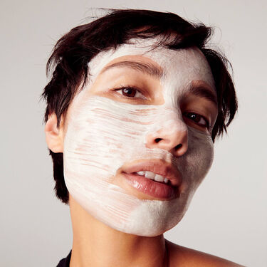 hands holding cleansers