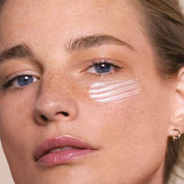 Women with cleanser on their faces 