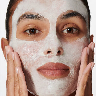 Women with cleanser on their faces 