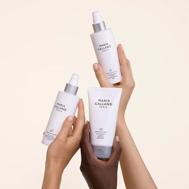 hands holding cleansers