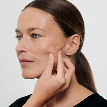 Women with cleanser on their faces 