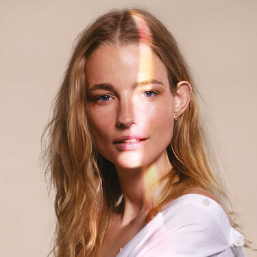 Women with cleanser on their faces 